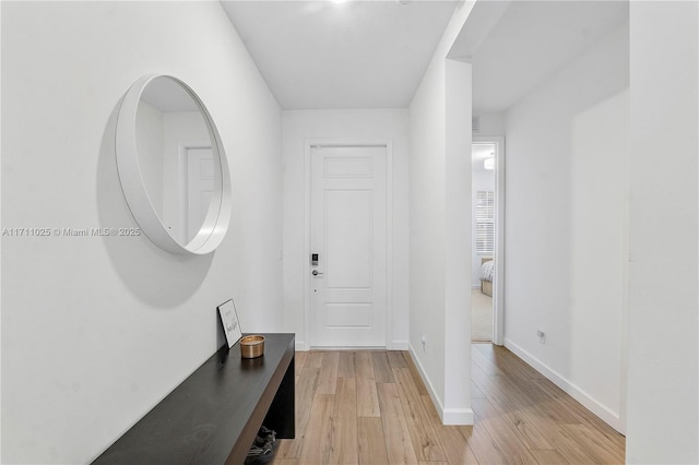 hallway with light wood-type flooring