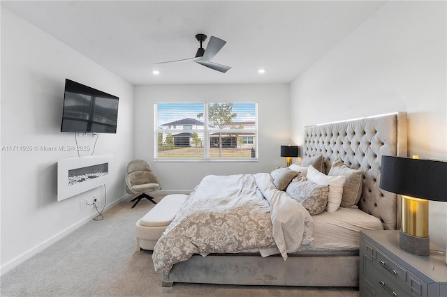 bedroom featuring light colored carpet and ceiling fan