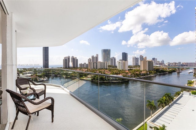 balcony featuring a water view