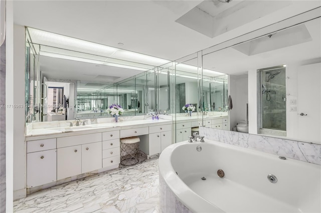 full bathroom featuring vanity, toilet, and separate shower and tub