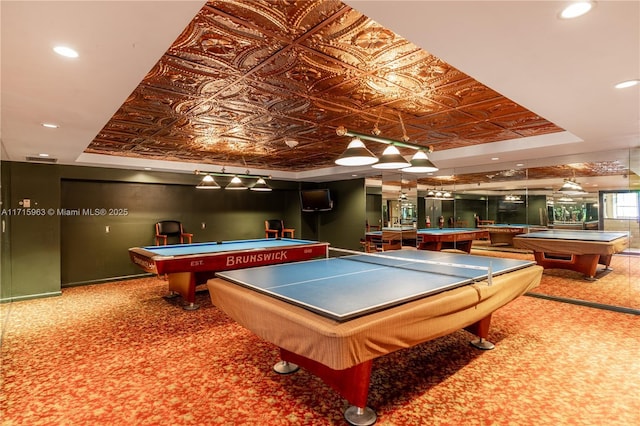 playroom with a raised ceiling and pool table