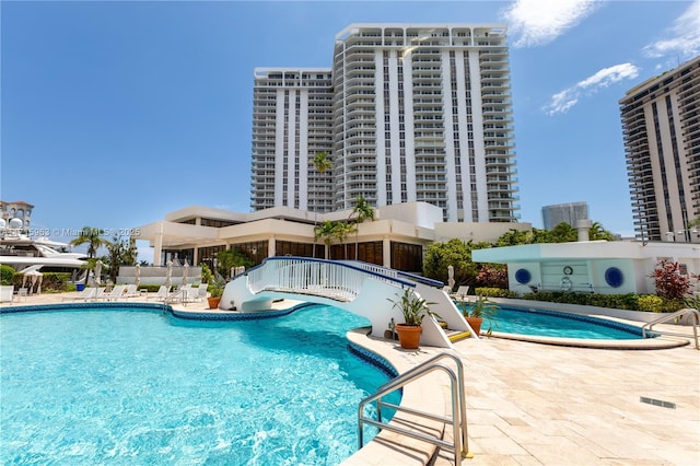 view of pool featuring a patio area