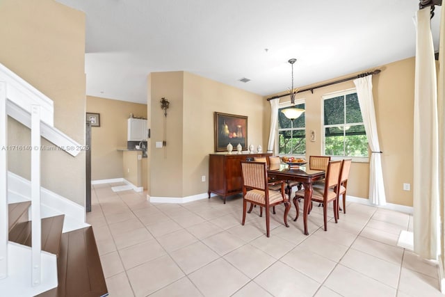 dining space with light tile patterned floors