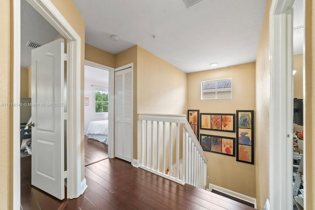 hallway featuring dark wood-type flooring