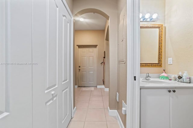 bathroom with tile patterned flooring and vanity