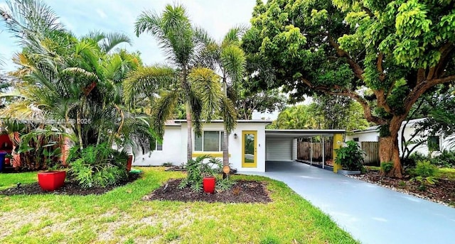 single story home with a front lawn and a carport