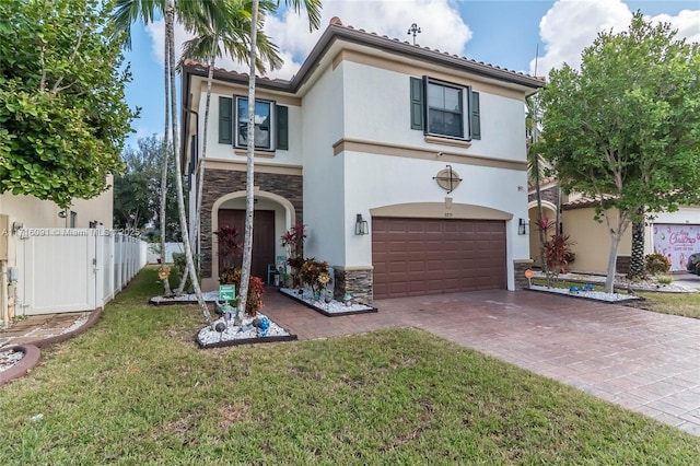 mediterranean / spanish-style house with a garage and a front lawn