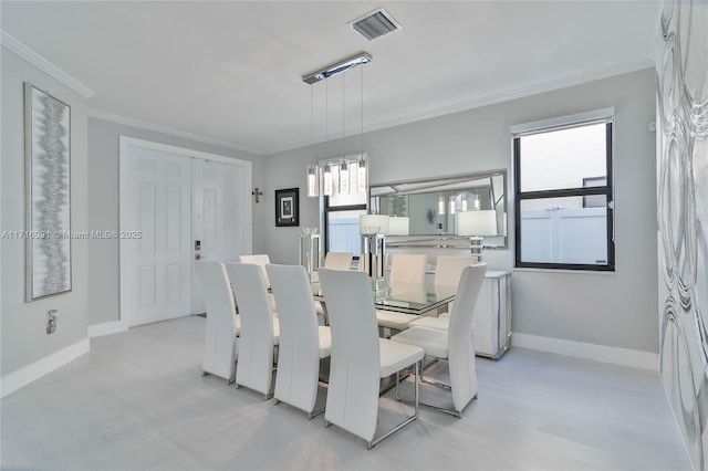 dining area with crown molding