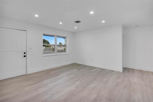 empty room featuring light hardwood / wood-style floors