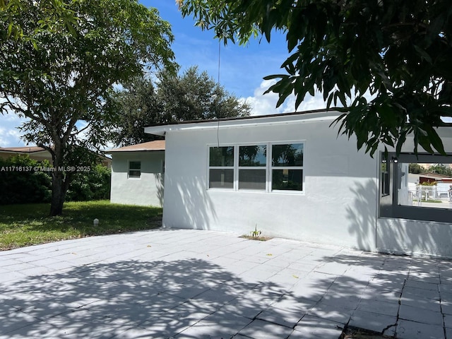 back of property with a patio area