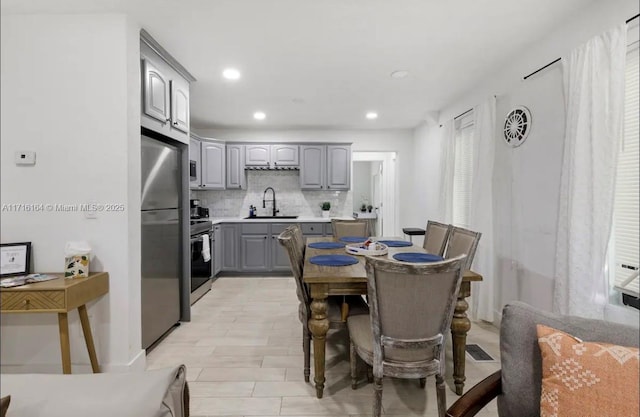 dining space featuring sink