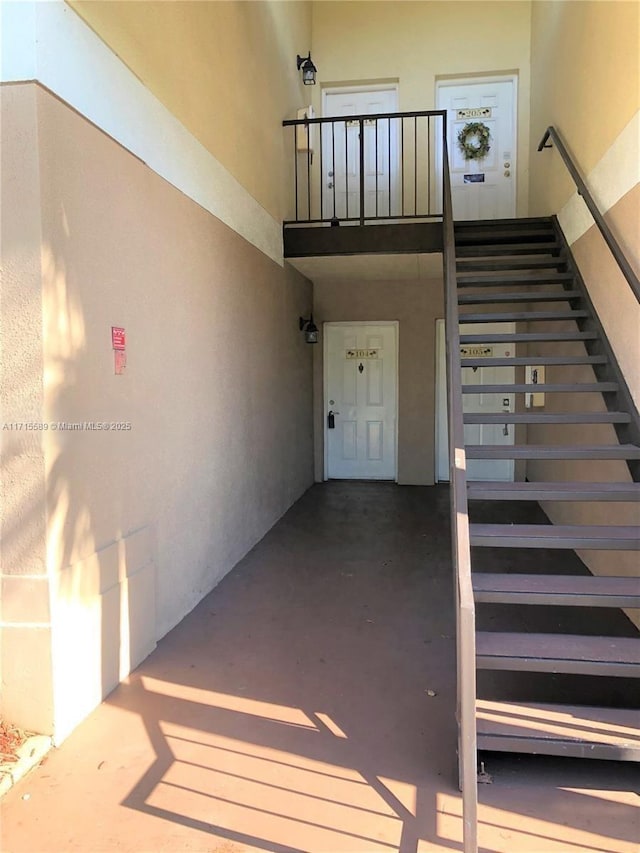 stairs with concrete floors