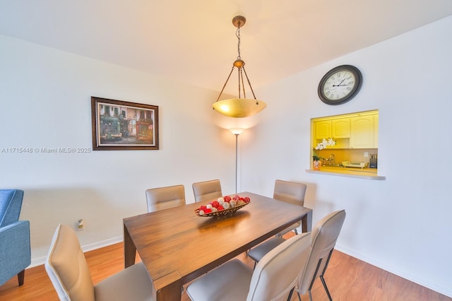 dining room with light hardwood / wood-style floors