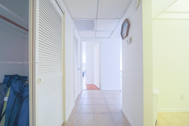 hallway with light tile patterned floors