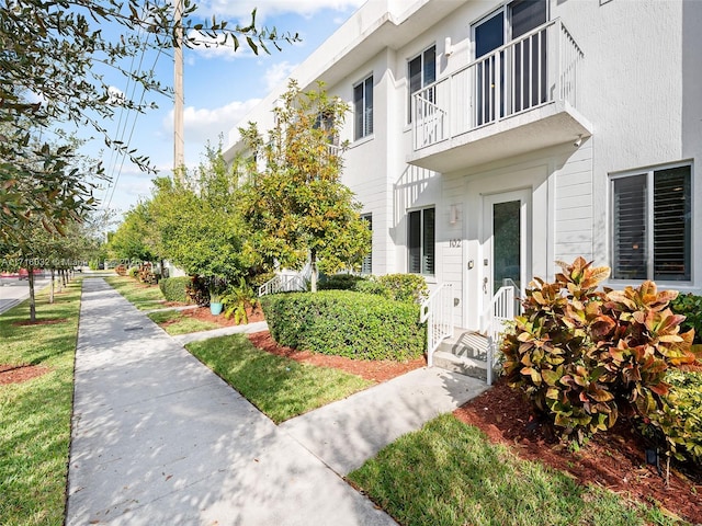 property entrance featuring stucco siding