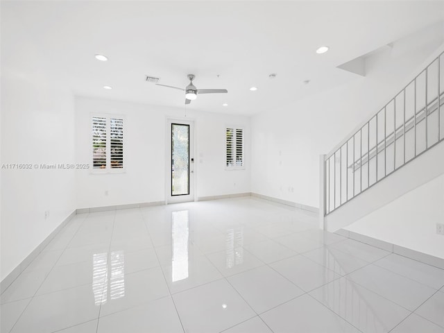 spare room featuring recessed lighting, ceiling fan, baseboards, and light tile patterned floors