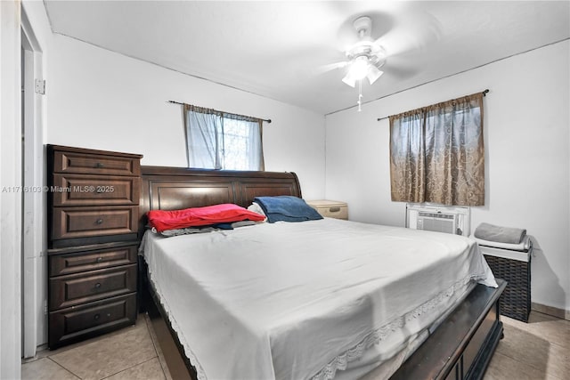 tiled bedroom featuring ceiling fan and cooling unit