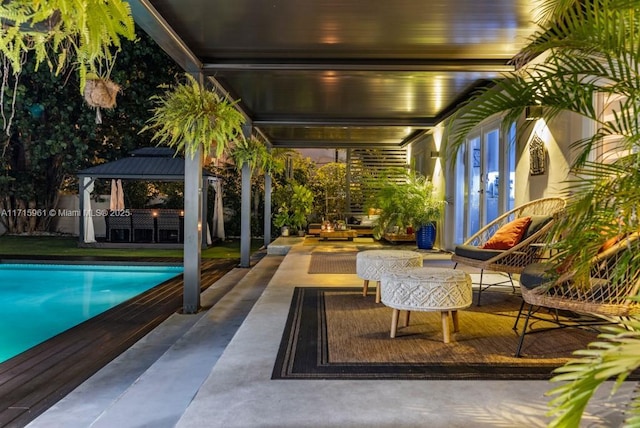 view of swimming pool featuring a gazebo and a patio area