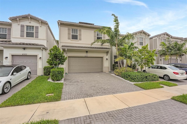 townhome / multi-family property featuring a garage