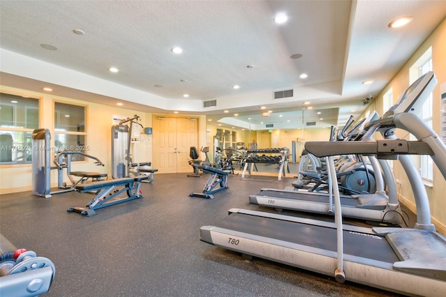 workout area featuring a textured ceiling