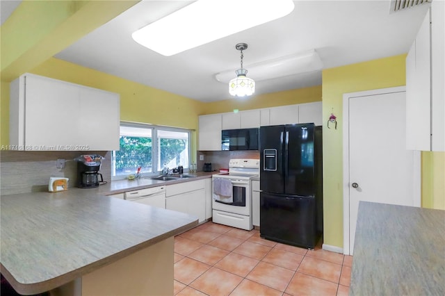 kitchen with white cabinetry, hanging light fixtures, tasteful backsplash, kitchen peninsula, and black appliances