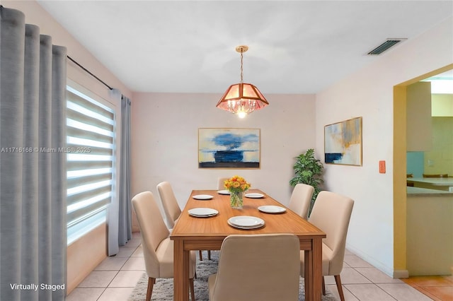 dining space with light tile patterned floors