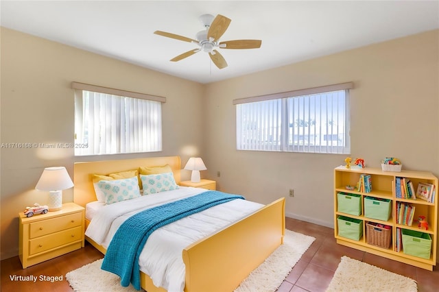 bedroom with tile patterned flooring and ceiling fan