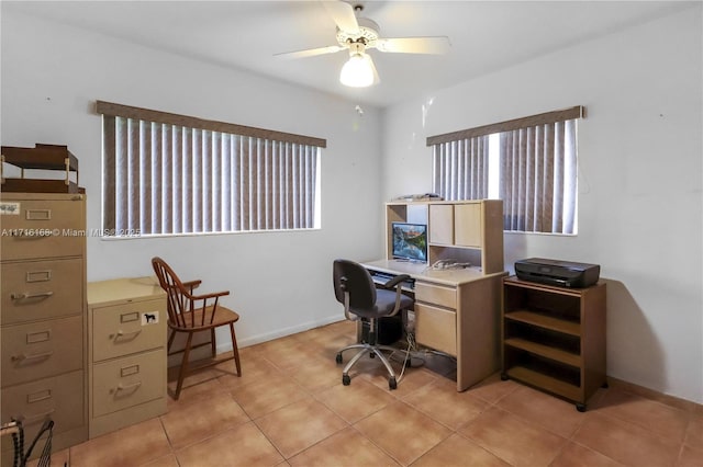 office space featuring light tile patterned floors and ceiling fan