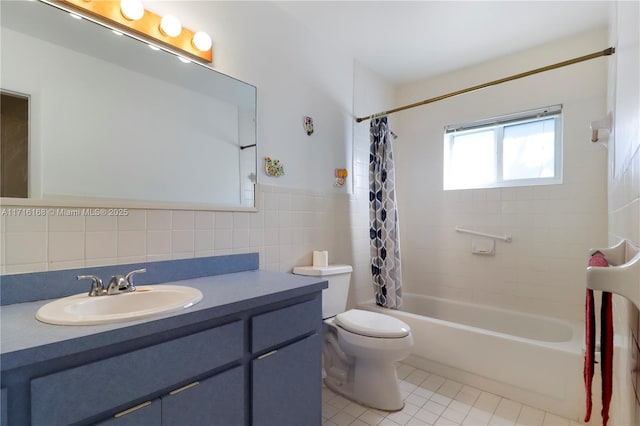 full bathroom featuring vanity, tile patterned flooring, toilet, tile walls, and shower / tub combo