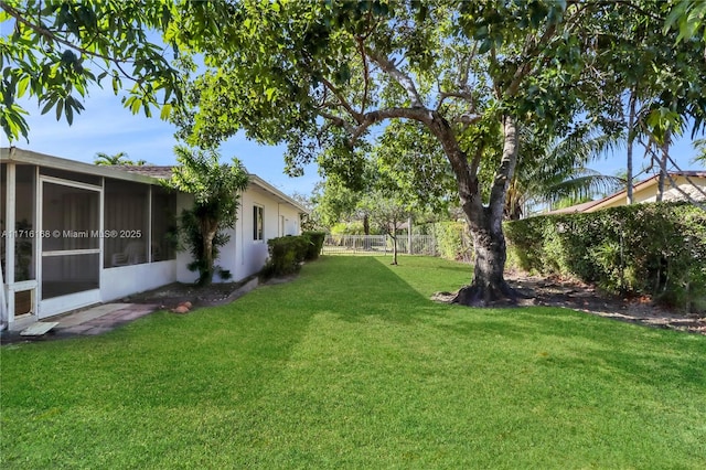 view of yard with a sunroom