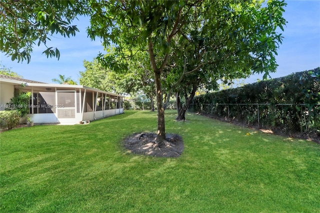 view of yard with a sunroom