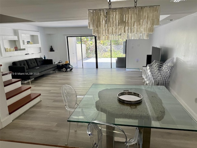 dining room with hardwood / wood-style floors