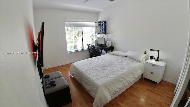 bedroom featuring hardwood / wood-style flooring