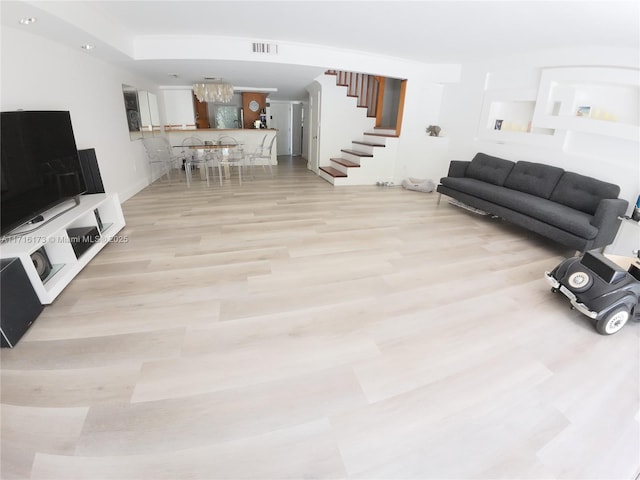 living room with light hardwood / wood-style flooring