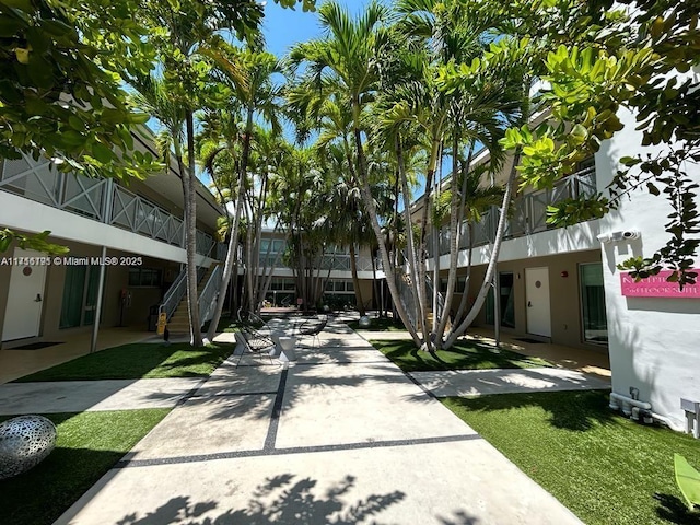 view of community featuring stairs