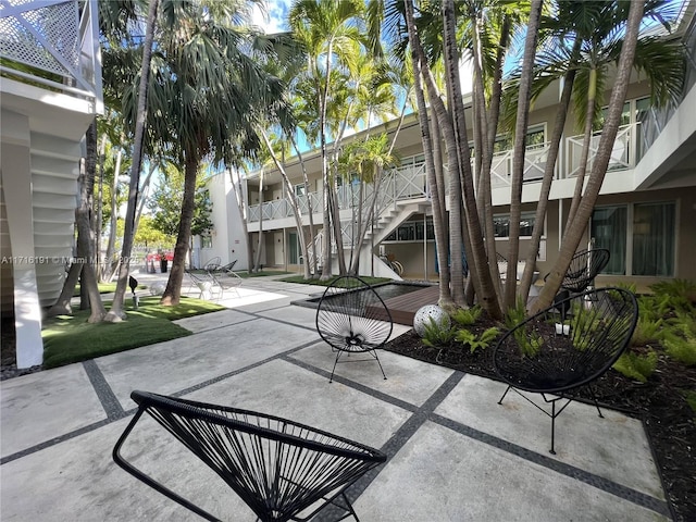 view of home's community featuring a patio area