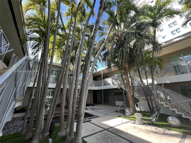 view of property featuring stairway