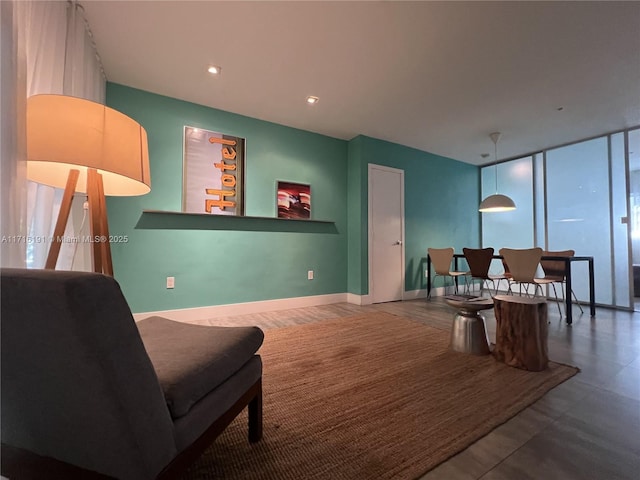 living area with expansive windows, recessed lighting, and baseboards