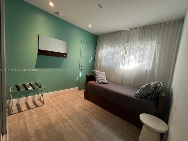 bedroom featuring recessed lighting, baseboards, and tile patterned floors