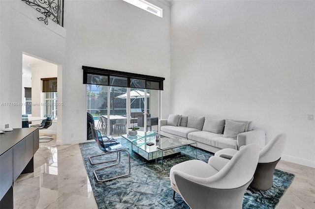 living room with a high ceiling