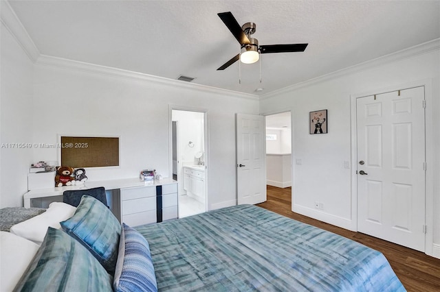 bedroom featuring crown molding, ensuite bath, ceiling fan, dark hardwood / wood-style floors, and a textured ceiling