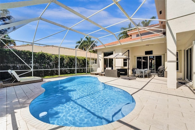 view of swimming pool with a lanai, an outdoor hangout area, and a patio