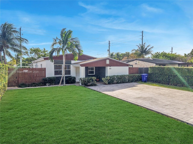 ranch-style house with a front yard