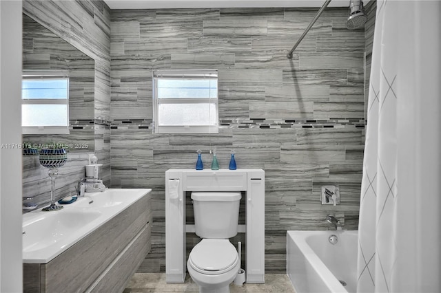 bathroom featuring shower / bath combination and toilet