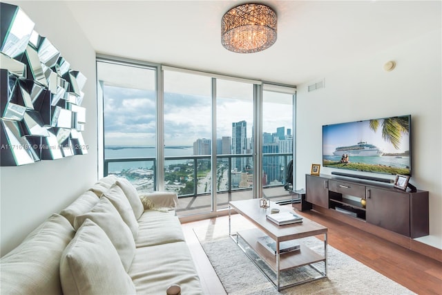 living room with hardwood / wood-style flooring and expansive windows