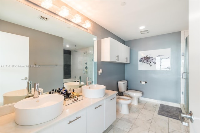 full bathroom featuring vanity, separate shower and tub, toilet, and a bidet