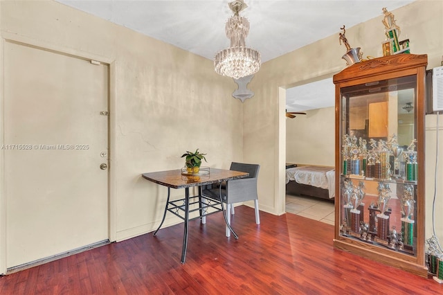 interior space featuring wood-type flooring and an inviting chandelier