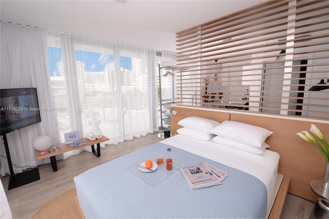 bedroom featuring light wood-type flooring