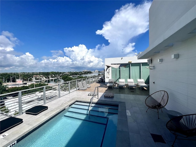 view of swimming pool featuring a patio