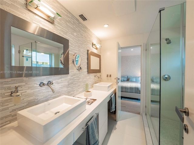 bathroom featuring vanity, tile patterned floors, and a shower with shower door